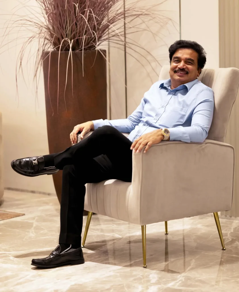 Dr. G.V. Rao, Founder of SAS Infra, seated in a modern office lounge.