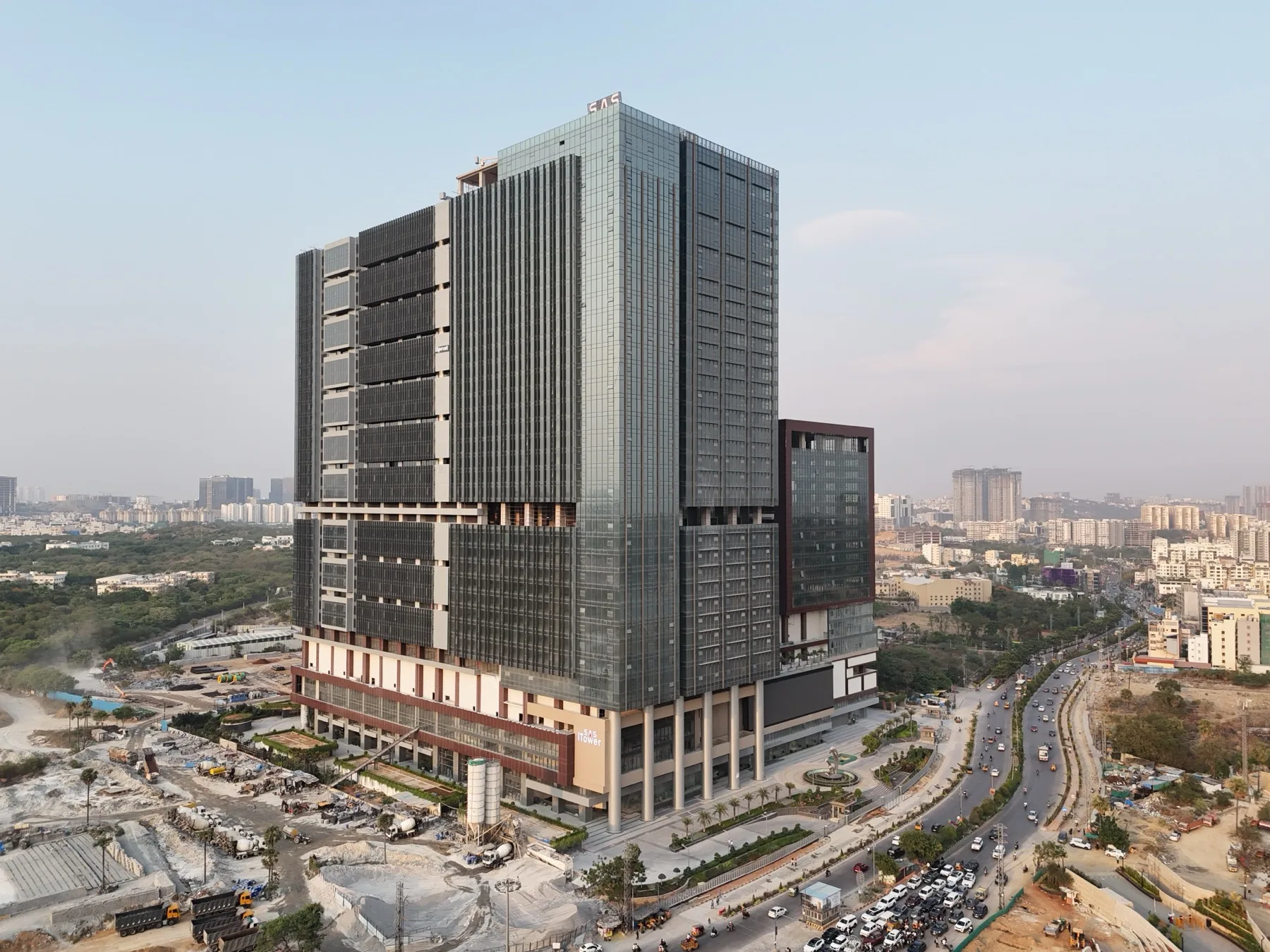 SAS iTower under construction at dusk, April 2026